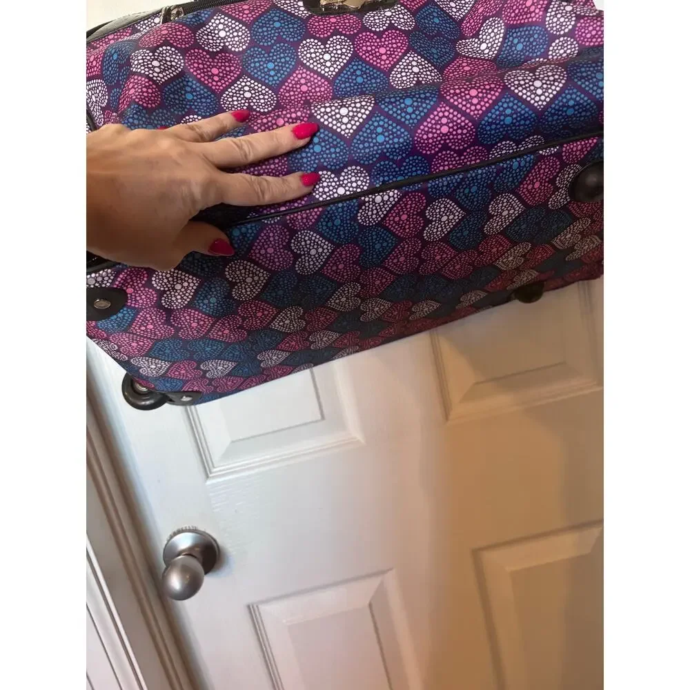 Kathy Van Zeeland 22-inch rolling weekender duffle bag.